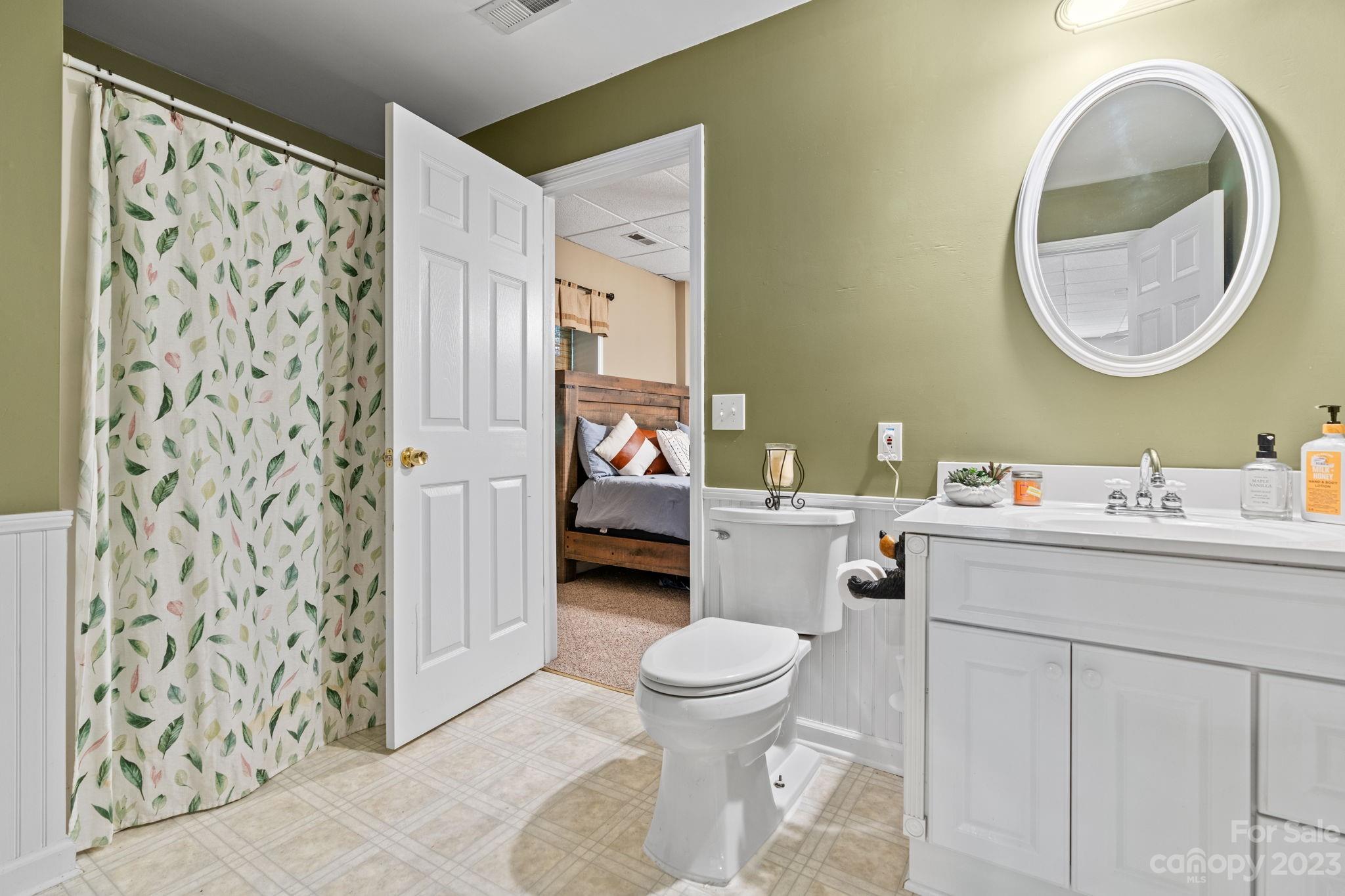 42 Bear Trail Fairview, NC 28730 - Photo 32 of 37 a bathroom with a sink toilet and shower