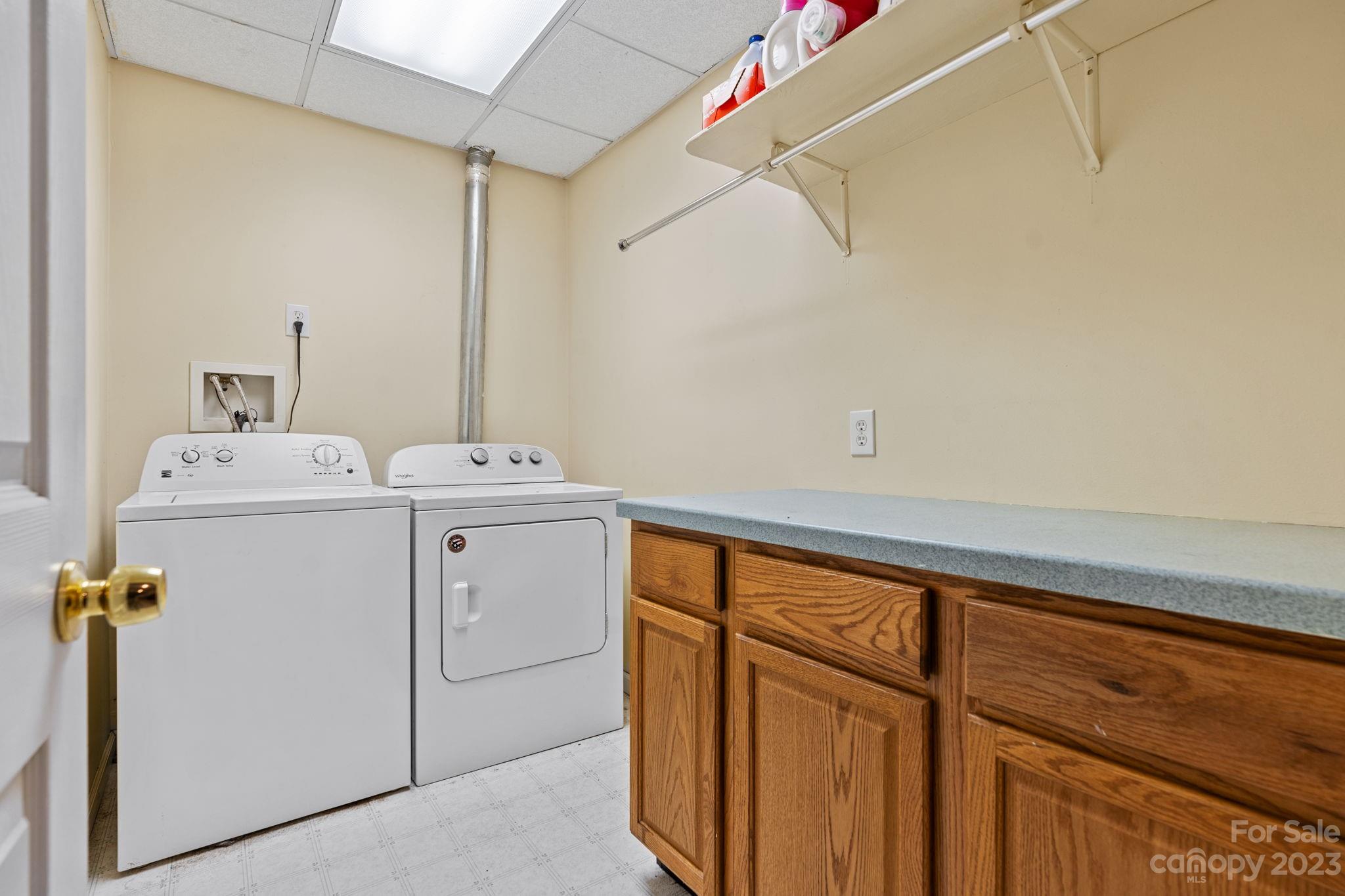 42 Bear Trail Fairview, NC 28730 - Photo 33 of 37 a utility room with dryer and washer
