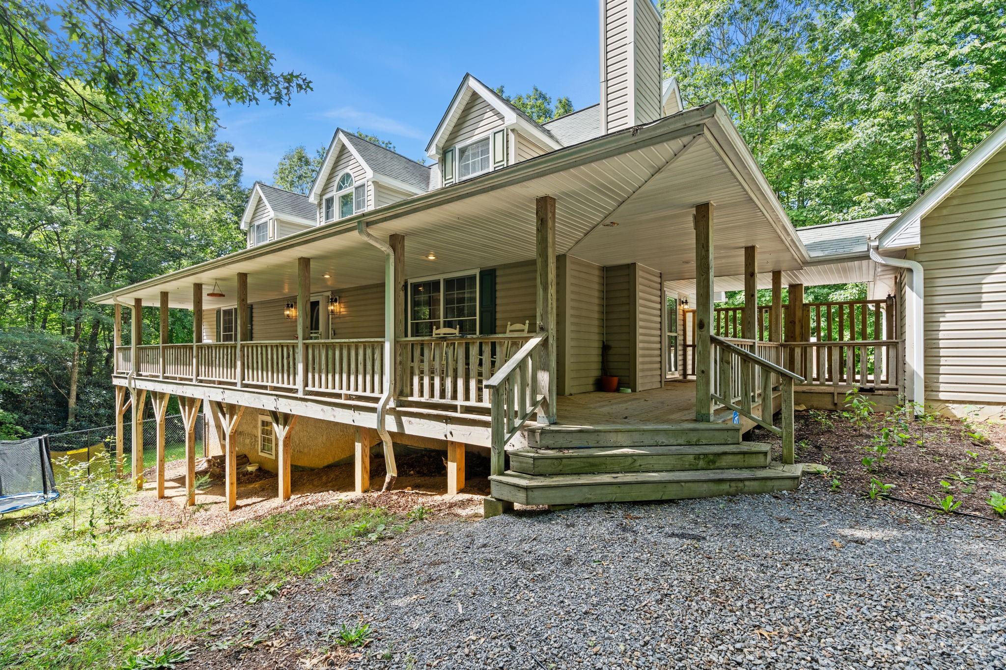 42 Bear Trail Fairview, NC 28730 - Photo 4 of 37 a view of a house with a yard porch and wooden floor