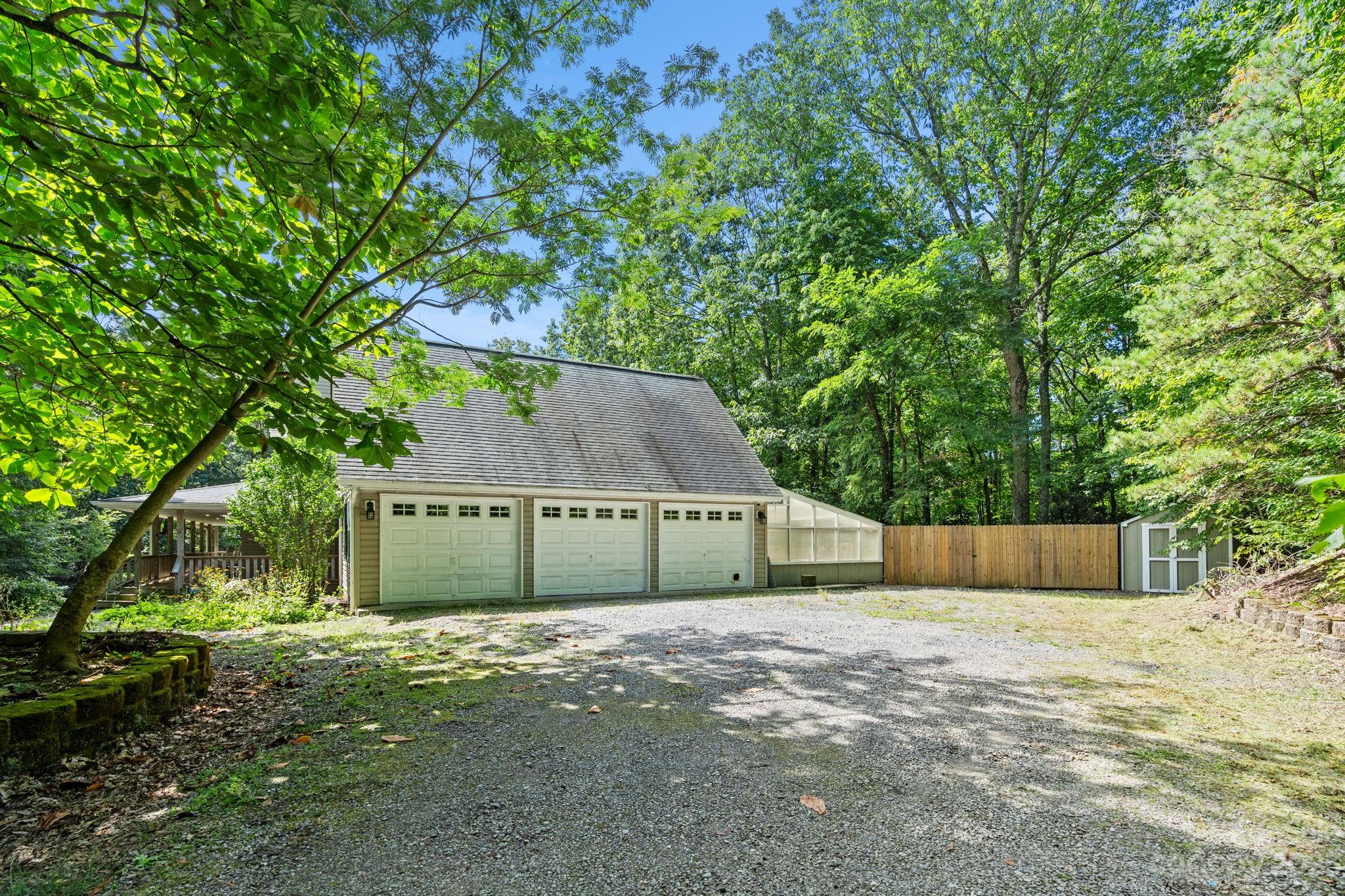42 Bear Trail Fairview, NC 28730 - Photo 6 of 37 a house that has a tree in front of it