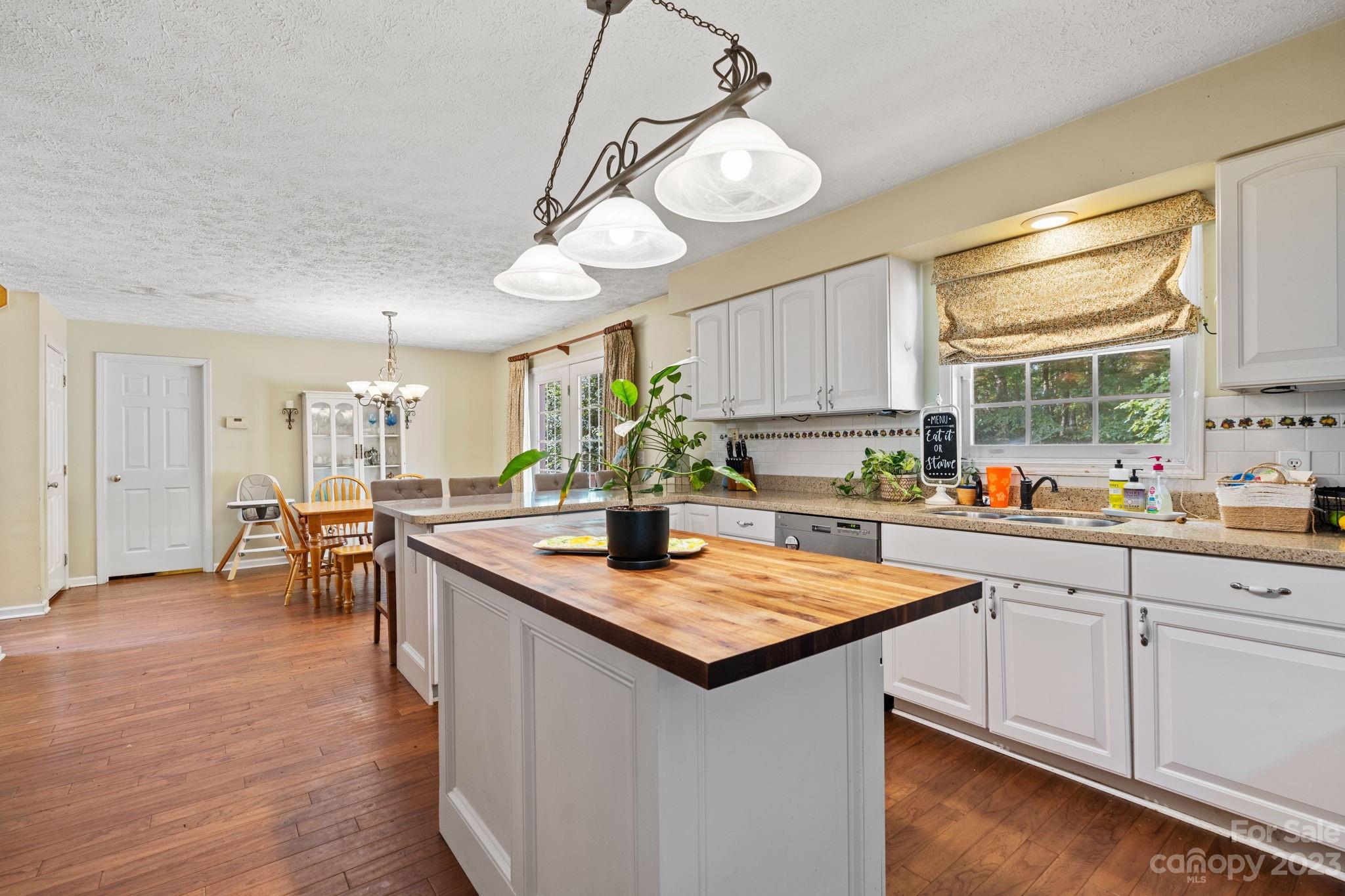42 Bear Trail Fairview, NC 28730 - Photo 10 of 37 a kitchen with center island and windows