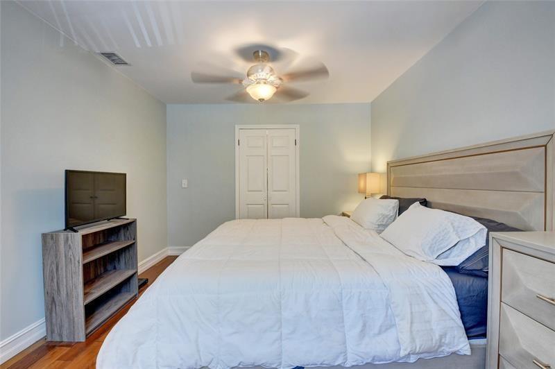 9316 Ketay Circle Boca Raton, FL 33428 - Photo 21 of 30 a bedroom with a bed and a flat screen tv