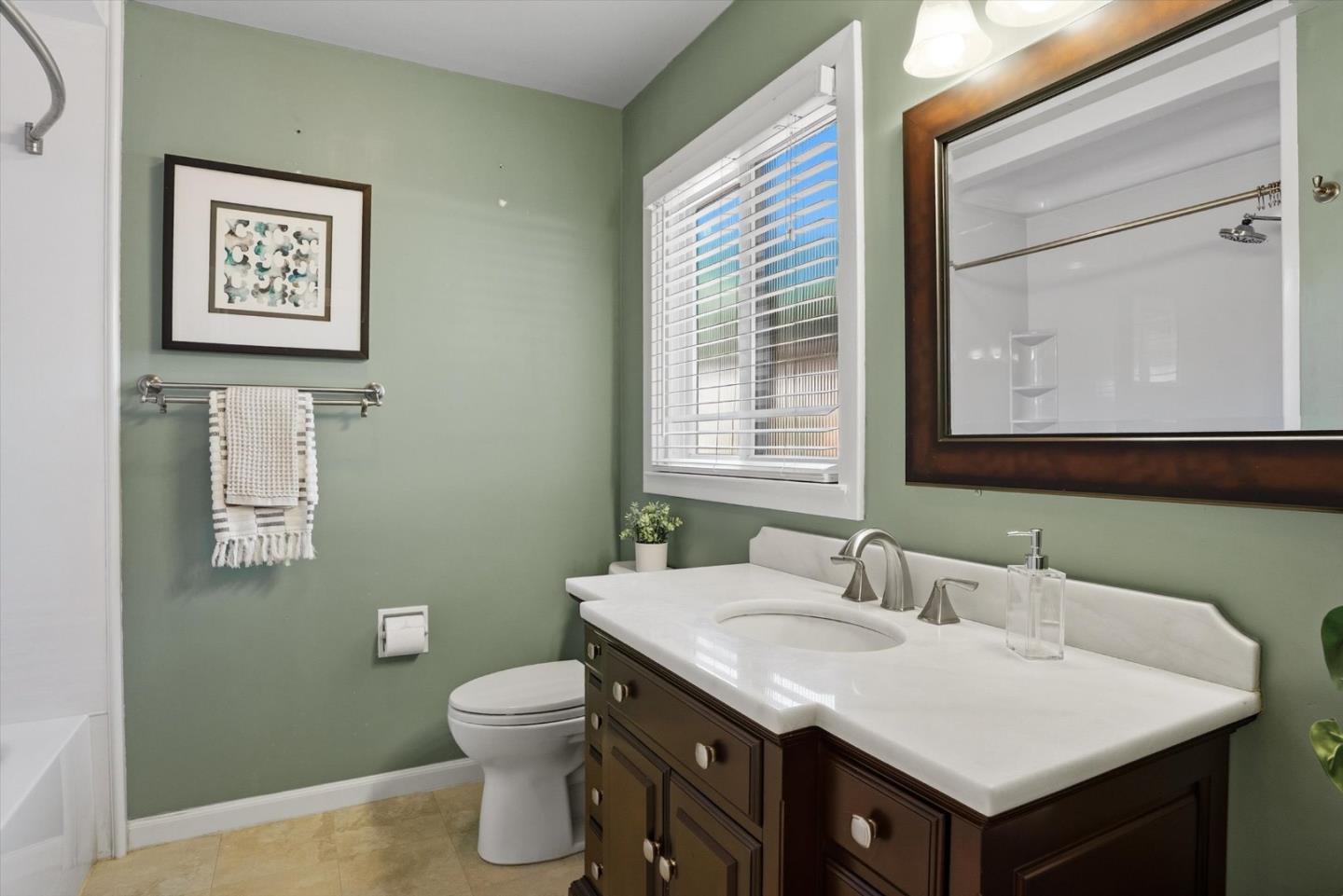 16899 Kennedy Road Los Gatos, CA 95032 - Photo 51 of 61 a bathroom with a granite countertop toilet sink and mirror