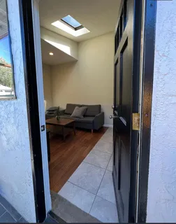 a living room with furniture and a gate