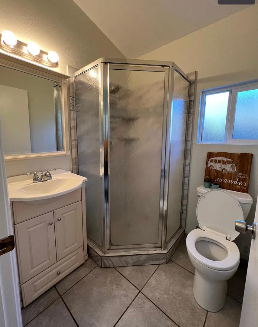 1302 Delaware Avenue Santa Cruz, CA 95060 - Photo 9 of 11 a bathroom with a sink a toilet and shower
