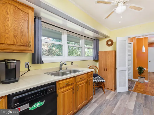 a bathroom with a sink a mirror and shower