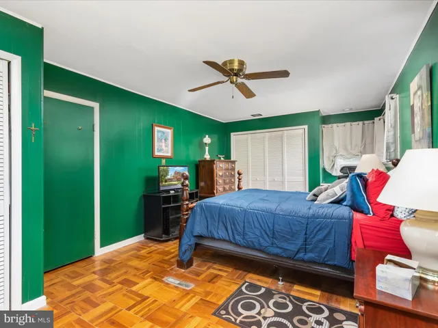 a bedroom with bed and a window