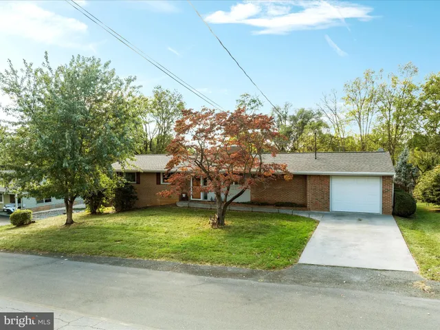 an aerial view of residential houses with outdoor space and swimming pool