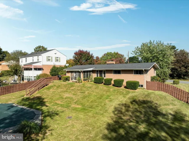 a view of house with yard