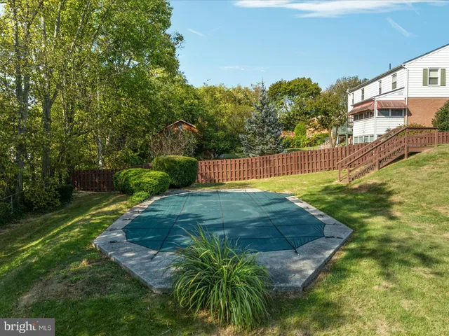 an aerial view of residential houses with city view