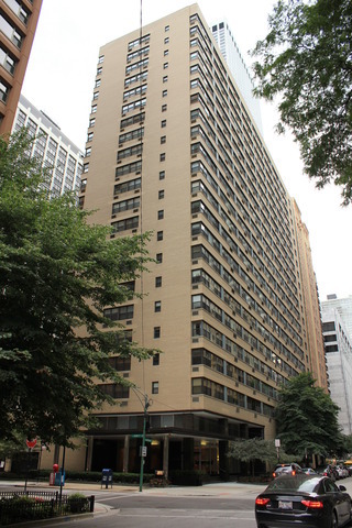 a view of a tall building and a street view