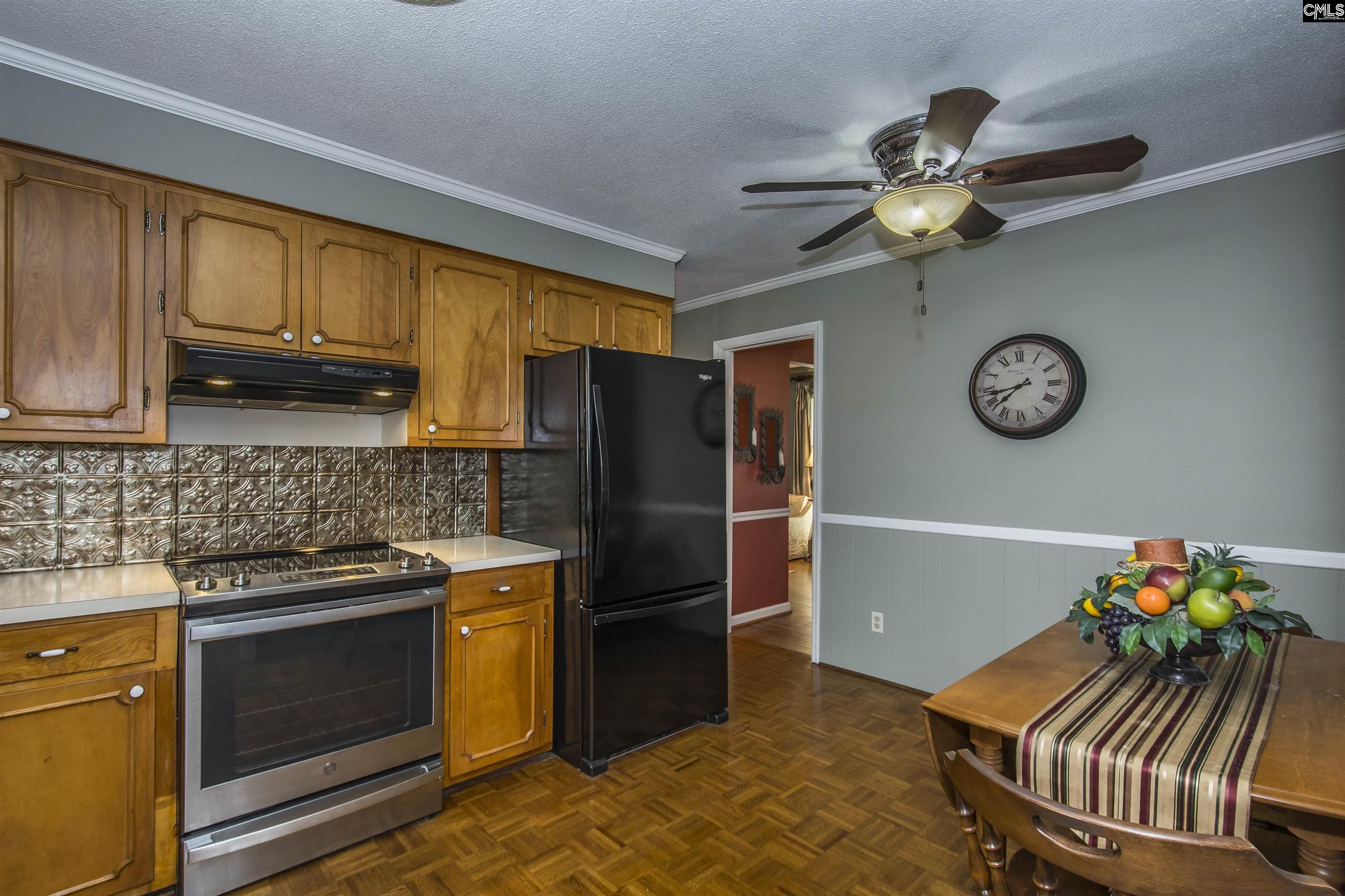2309 Cunningham Road Columbia, SC 29210 - Photo 29 of 41 a kitchen with stainless steel appliances granite countertop a stove refrigerator and a microwave oven