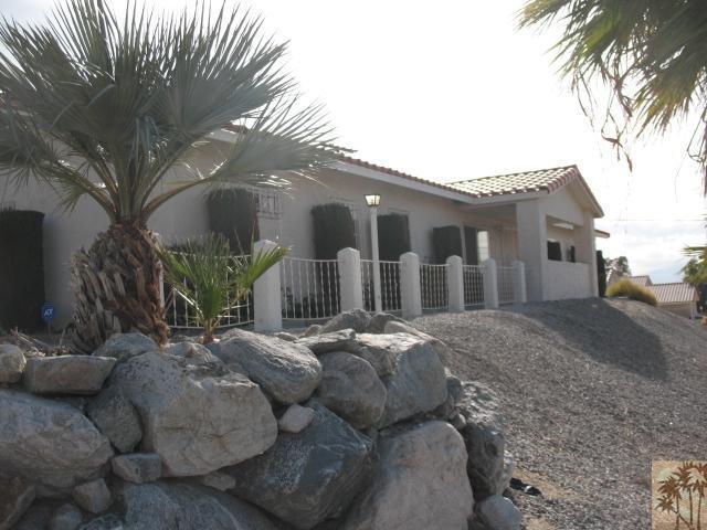 67145 San Ardo Road Desert Hot Springs, CA 92240 - Photo 1 of 20 a outdoor space with furniture and mirror