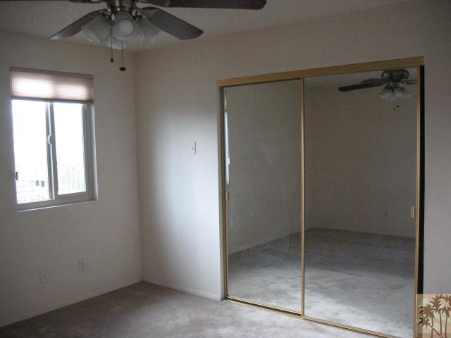 67145 San Ardo Road Desert Hot Springs, CA 92240 - Photo 11 of 20 a bathroom with a glass shower door