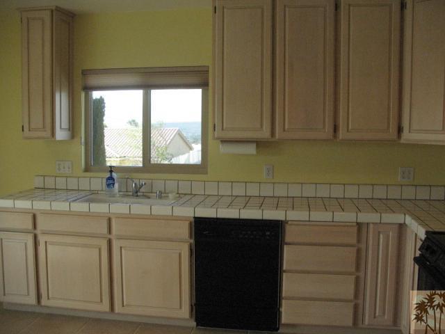 67145 San Ardo Road Desert Hot Springs, CA 92240 - Photo 3 of 20 a kitchen with a sink and cabinets