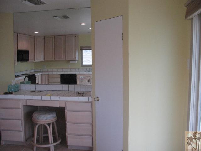 67145 San Ardo Road Desert Hot Springs, CA 92240 - Photo 5 of 20 a kitchen with a cabinets and appliances