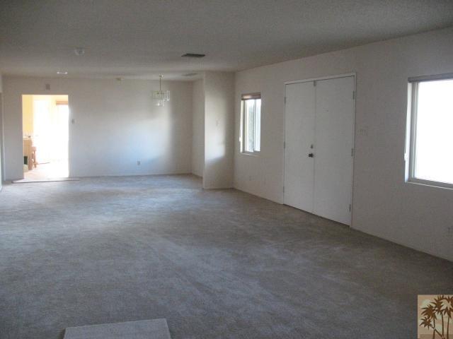 67145 San Ardo Road Desert Hot Springs, CA 92240 - Photo 6 of 20 an empty room with windows