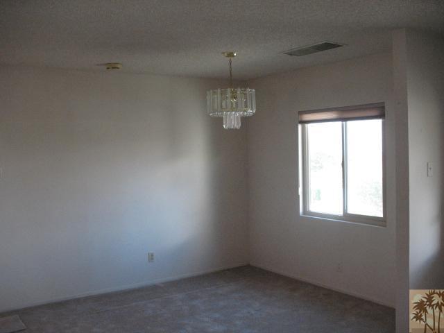 67145 San Ardo Road Desert Hot Springs, CA 92240 - Photo 7 of 20 an empty room with a window