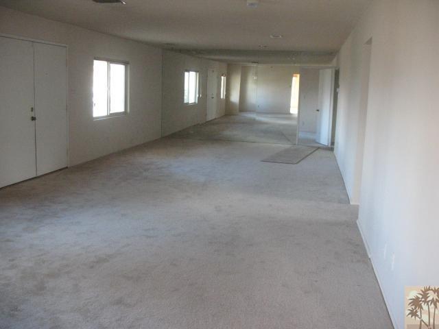 67145 San Ardo Road Desert Hot Springs, CA 92240 - Photo 8 of 20 an empty room with windows and entrance