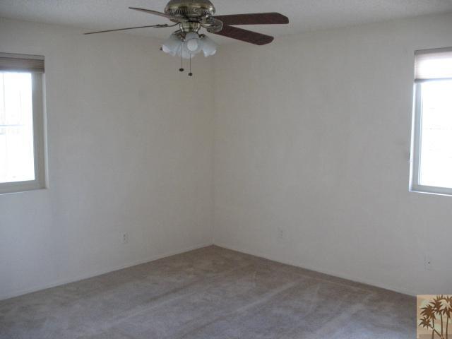 67145 San Ardo Road Desert Hot Springs, CA 92240 - Photo 10 of 20 an empty room with a window