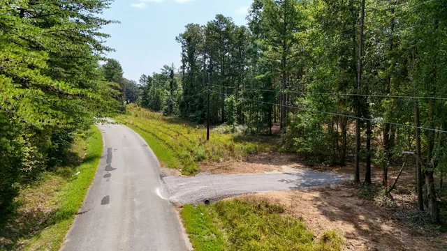 a view of a pathway with a yard