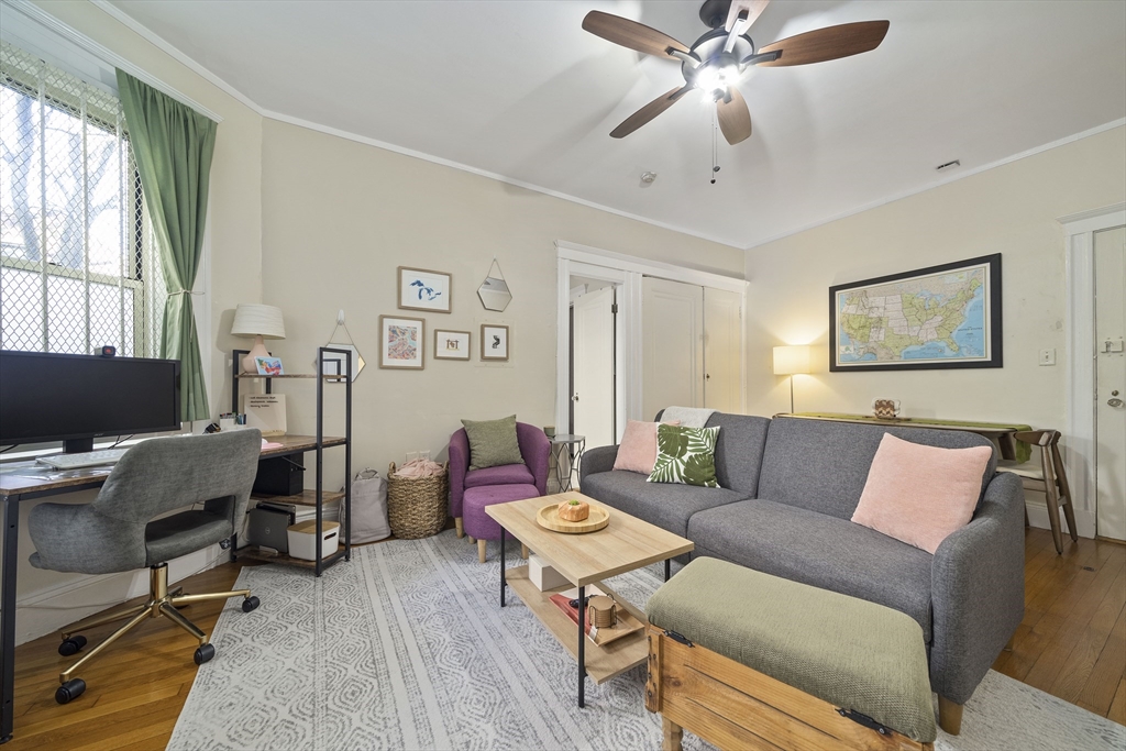 74 Fenway, Unit 35 Boston, MA 02115 - Photo 11 of 15 a living room with furniture and a window