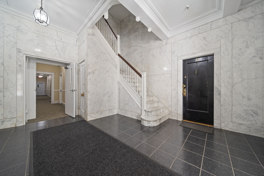74 Fenway, Unit 35 Boston, MA 02115 - Photo 3 of 15 a view of an entryway with wooden floor