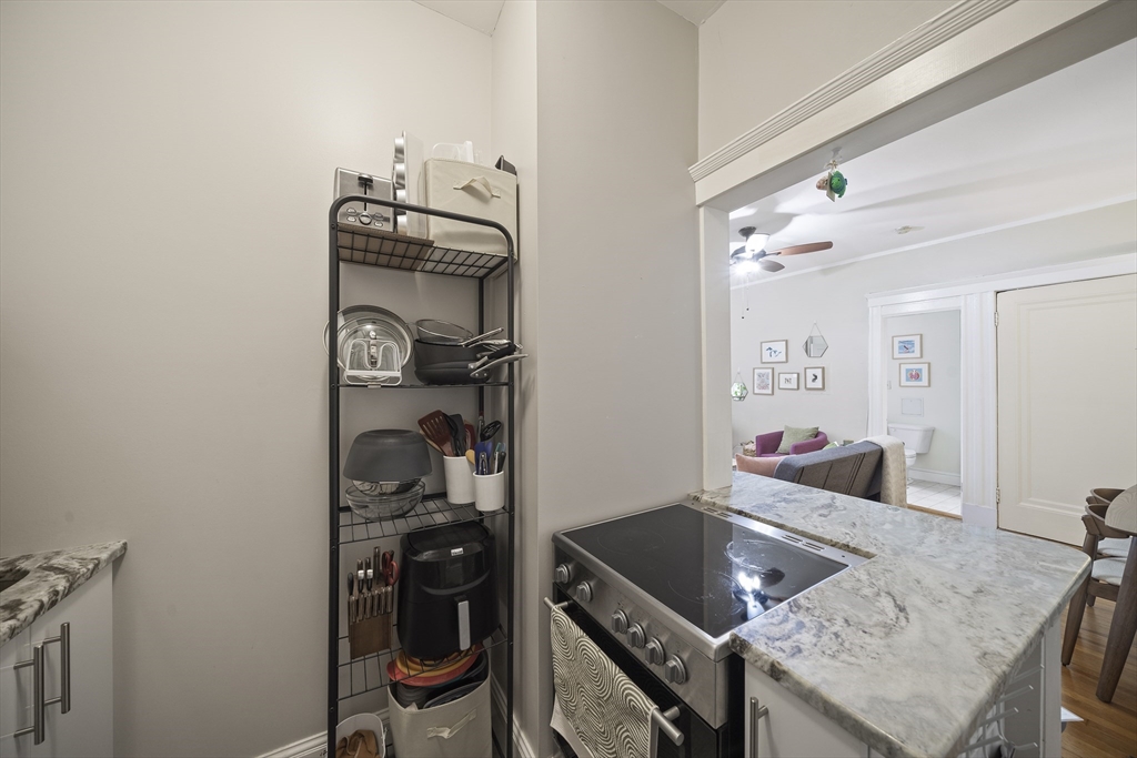 74 Fenway, Unit 35 Boston, MA 02115 - Photo 6 of 15 a kitchen with a sink and cabinets