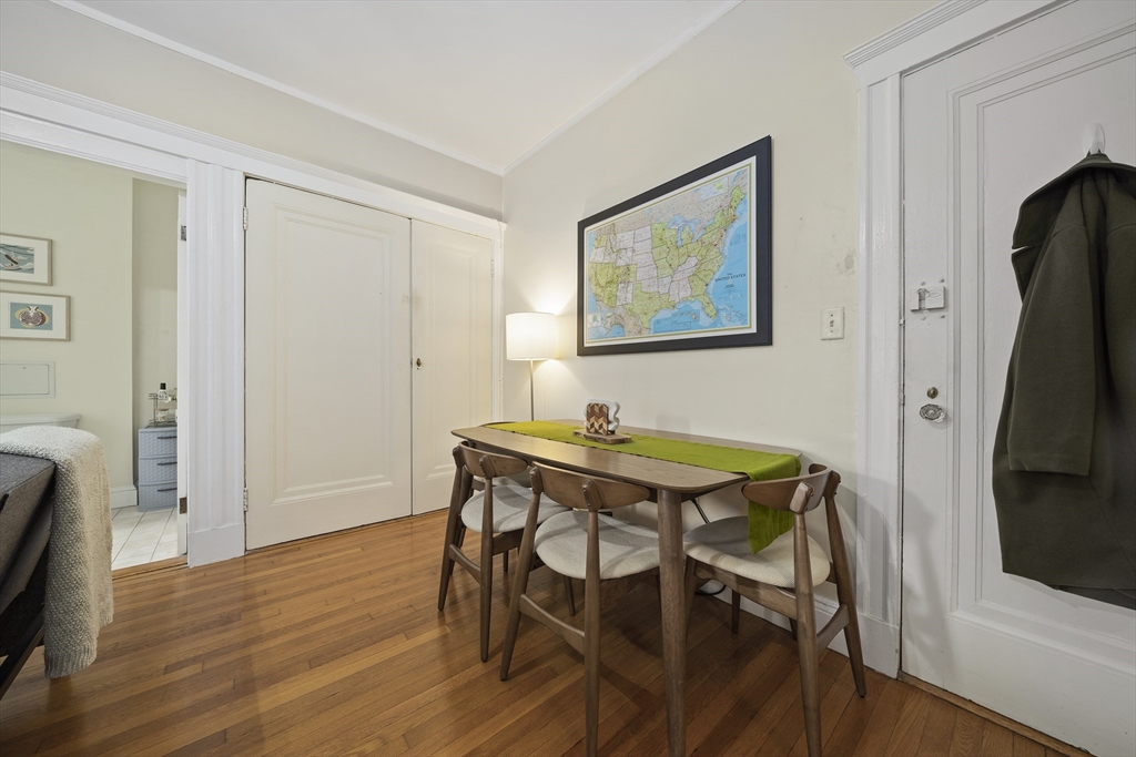 74 Fenway, Unit 35 Boston, MA 02115 - Photo 9 of 15 a view of a dining room with furniture and wooden floor