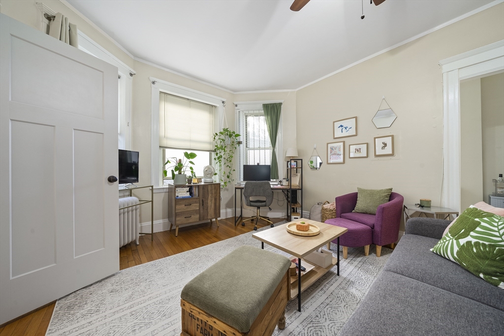 74 Fenway, Unit 35 Boston, MA 02115 - Photo 10 of 15 a living room with furniture and a flat screen tv