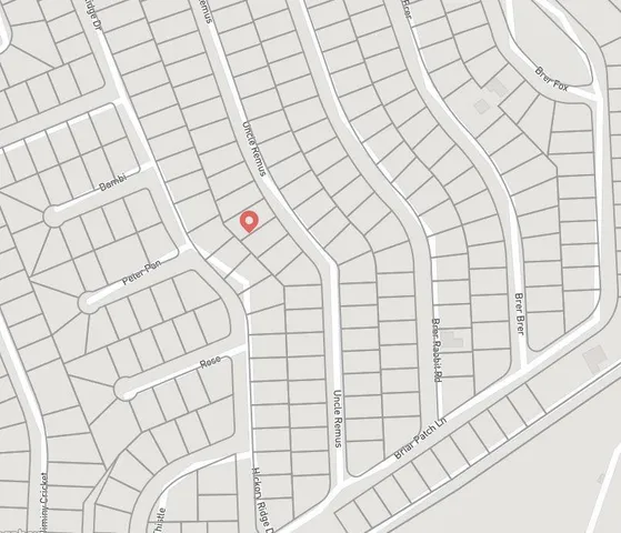 an aerial view of a house with outdoor space