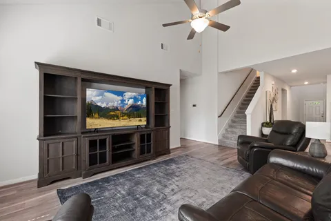 a living room with furniture and a flat screen tv
