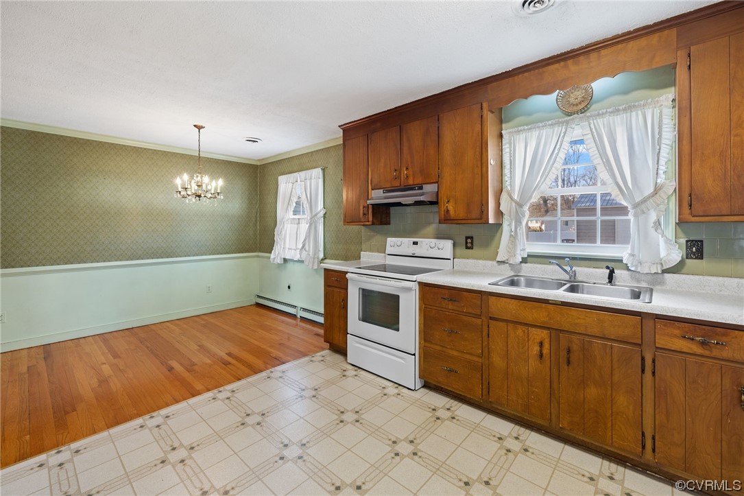 2408 Coxendale Road Chester, VA 23831 - Photo 12 of 26 a kitchen with stainless steel appliances kitchen island granite countertop a sink cabinets and wooden floor