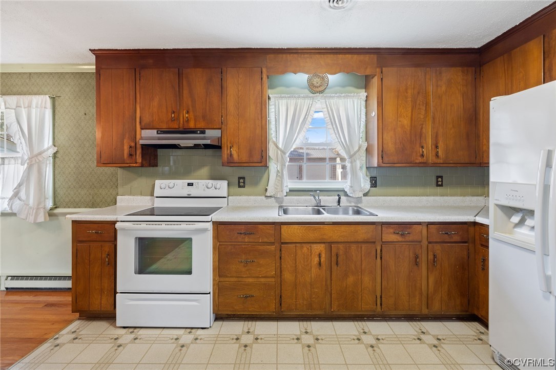 2408 Coxendale Road Chester, VA 23831 - Photo 13 of 26 a kitchen with stainless steel appliances granite countertop a sink stove and refrigerator
