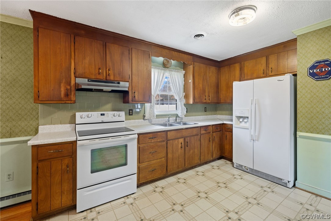 2408 Coxendale Road Chester, VA 23831 - Photo 14 of 26 a kitchen with a stove sink and refrigerator