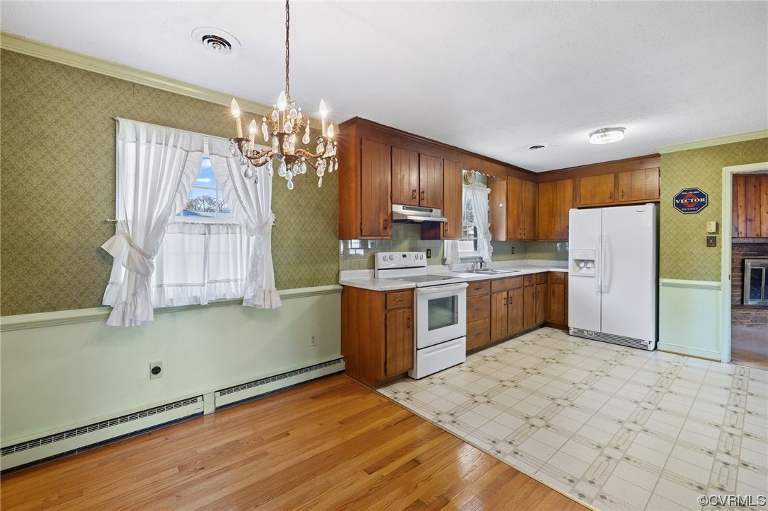 2408 Coxendale Road Chester, VA 23831 - Photo 16 of 26 a kitchen with stainless steel appliances granite countertop a refrigerator a sink dishwasher a stove with white cabinets and wooden floor