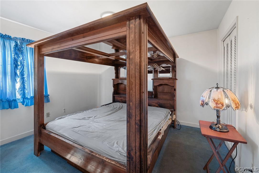 2408 Coxendale Road Chester, VA 23831 - Photo 20 of 26 a bedroom with a bed and a lamp on the dresser