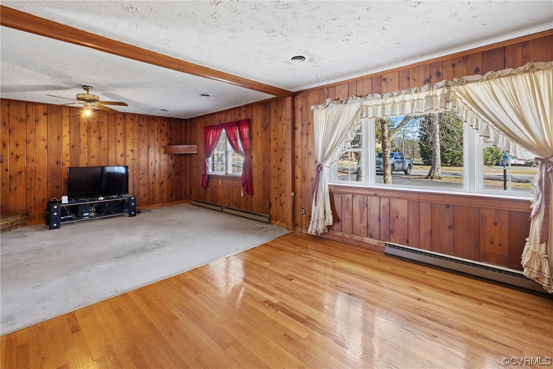 2408 Coxendale Road Chester, VA 23831 - Photo 6 of 26 a view of a livingroom with furniture a flat screen tv and windows