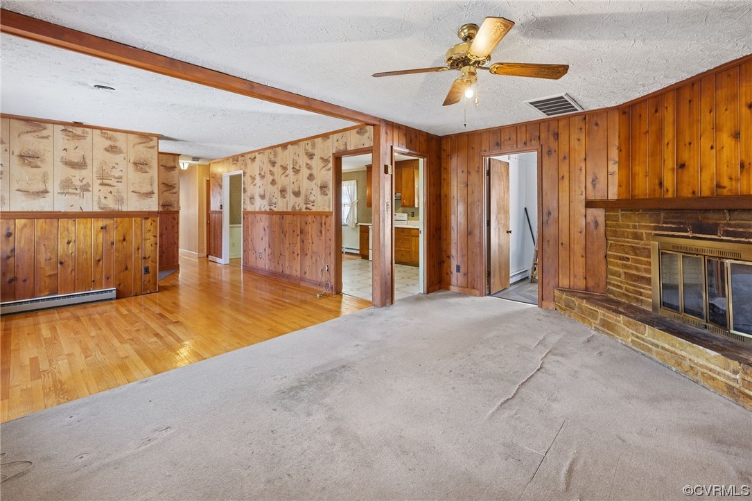 2408 Coxendale Road Chester, VA 23831 - Photo 10 of 26 a view of an empty room with a fireplace and a ceiling fan