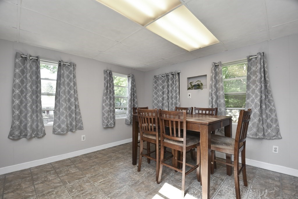 8 Deb Road Woburn, MA 01801 - Photo 11 of 34 a view of a dining room with furniture and window