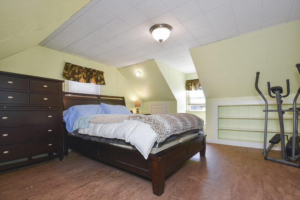 8 Deb Road Woburn, MA 01801 - Photo 18 of 34 a bedroom with a bed and a cabinets