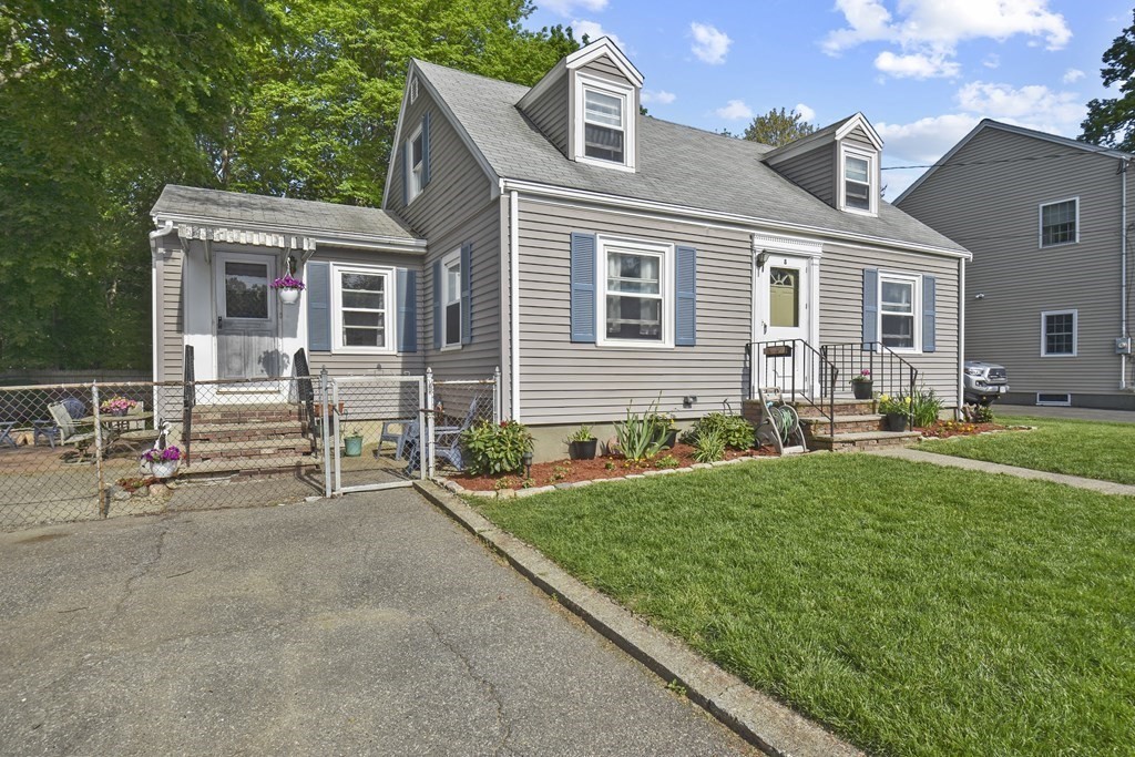 8 Deb Road Woburn, MA 01801 - Photo 2 of 34 a front view of house with yard and outdoor seating
