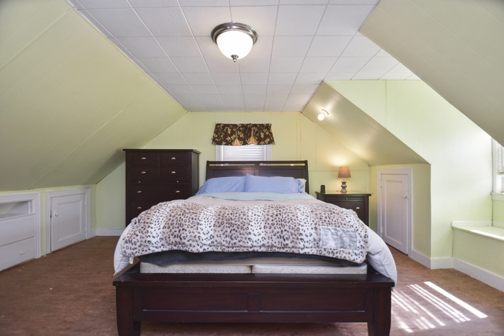 8 Deb Road Woburn, MA 01801 - Photo 21 of 34 a bedroom with a bed and a dresser