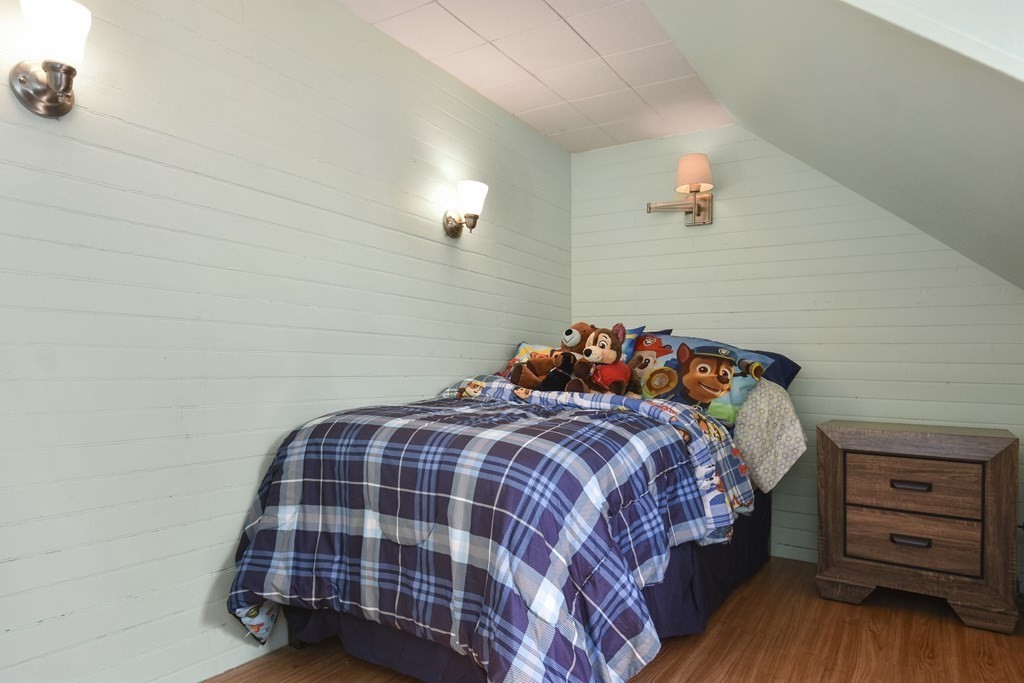8 Deb Road Woburn, MA 01801 - Photo 22 of 34 a bedroom with a bed and a dresser