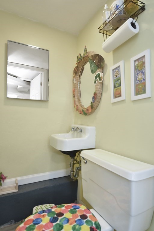 8 Deb Road Woburn, MA 01801 - Photo 28 of 34 a bathroom with a sink a toilet and a mirror