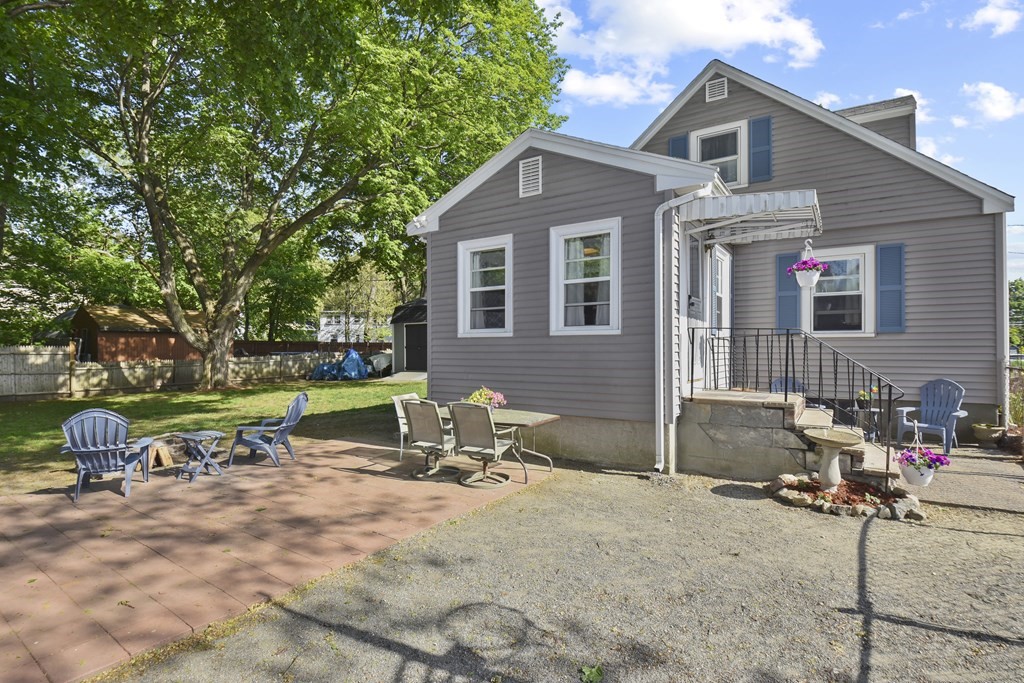 8 Deb Road Woburn, MA 01801 - Photo 29 of 34 a view of a house with backyard and a tree