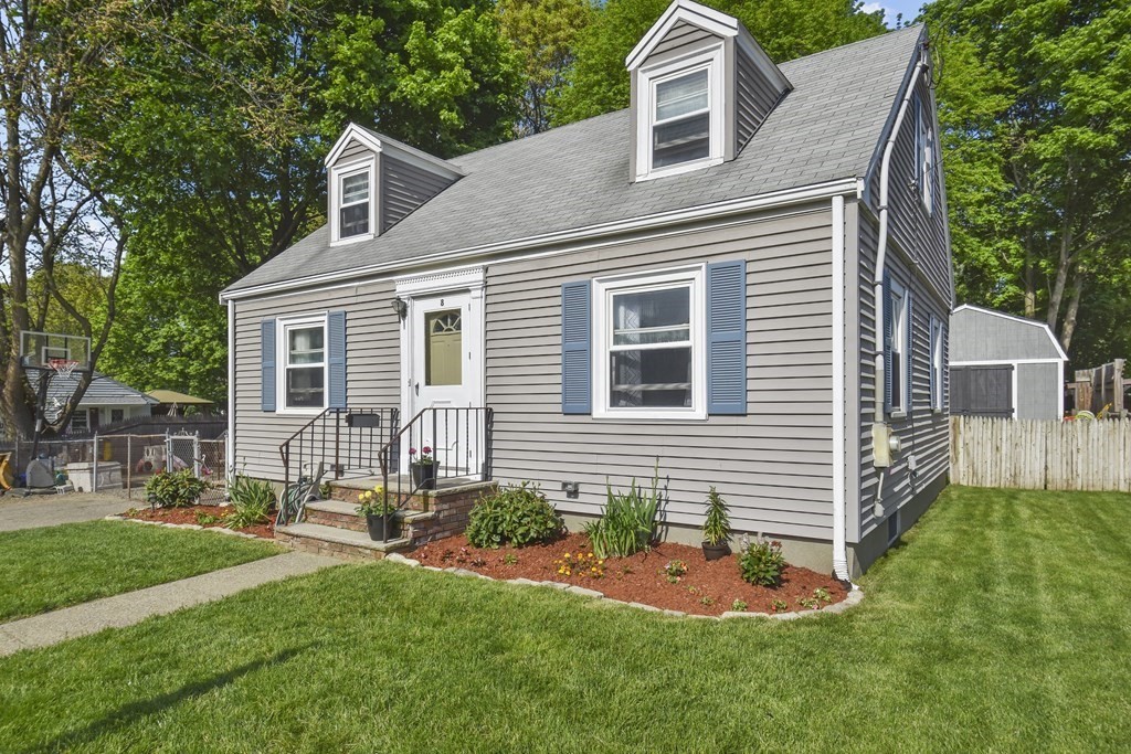 8 Deb Road Woburn, MA 01801 - Photo 3 of 34 a front view of a house with a yard