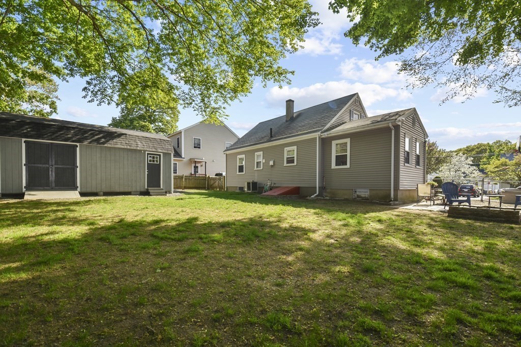 8 Deb Road Woburn, MA 01801 - Photo 32 of 34 a front view of house with yard and trees around