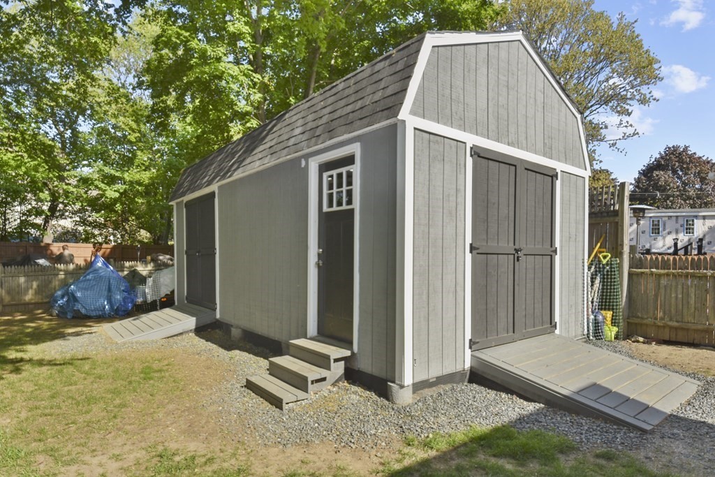 8 Deb Road Woburn, MA 01801 - Photo 33 of 34 a view of a house with backyard and sitting area