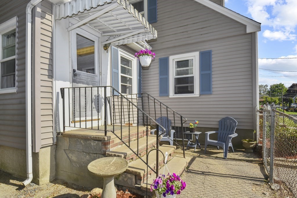 8 Deb Road Woburn, MA 01801 - Photo 5 of 34 a front view of a house with patio